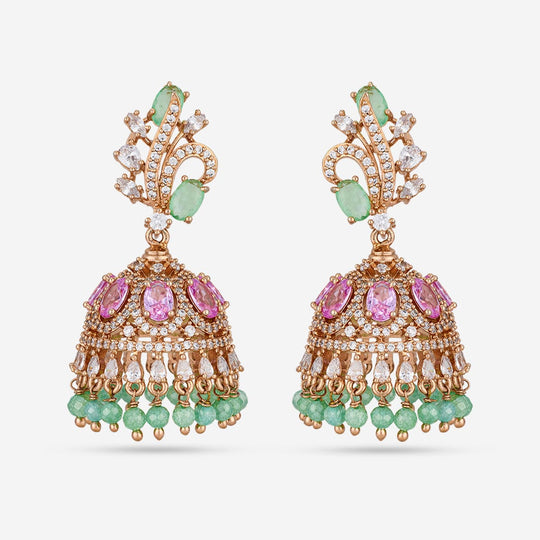 Gold-tone zircon jhumka earrings with green and pink stones, on white background.