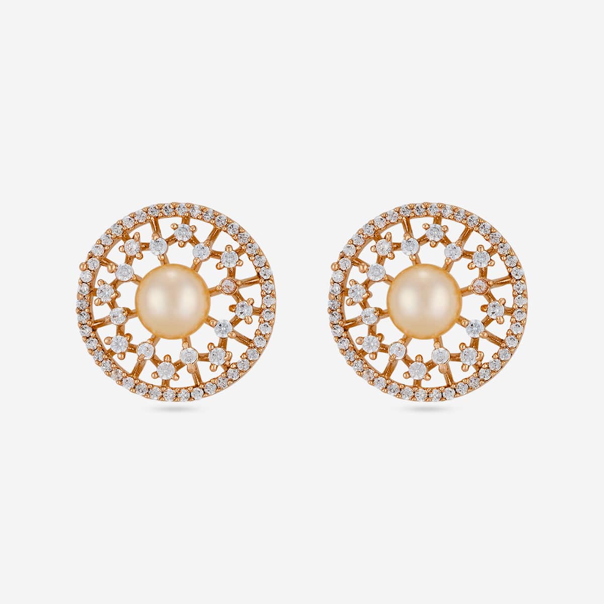 Gold-tone zircon and pearl stud earrings with floral design, front view.