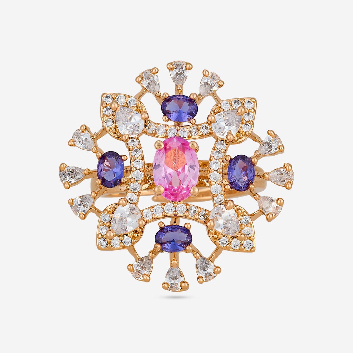 Gold-tone zircon ring with pink and purple stones, top view.