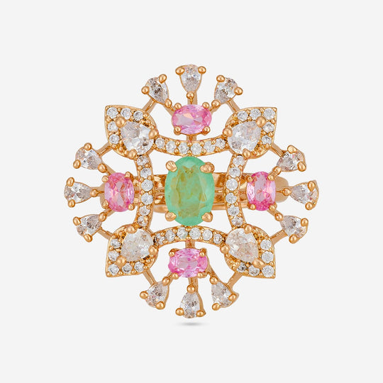 Gold-tone zircon ring with green and pink stones, top view.