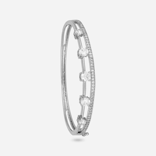 Silver-tone zircon kada with white stones, side view on white background.