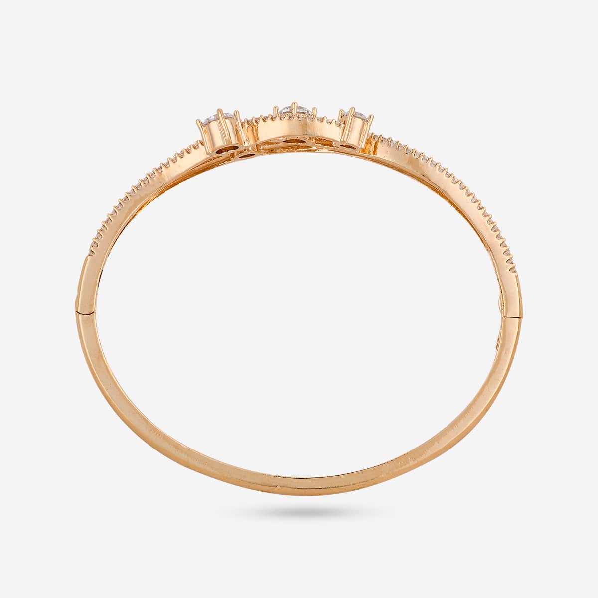 Gold-tone zircon kada with white stones, top view showing full circle.