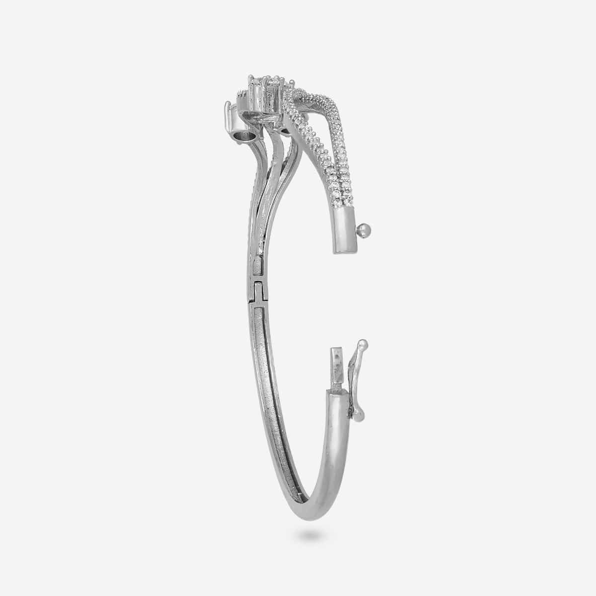 Silver-tone zircon kada with white stones, open clasp side view.