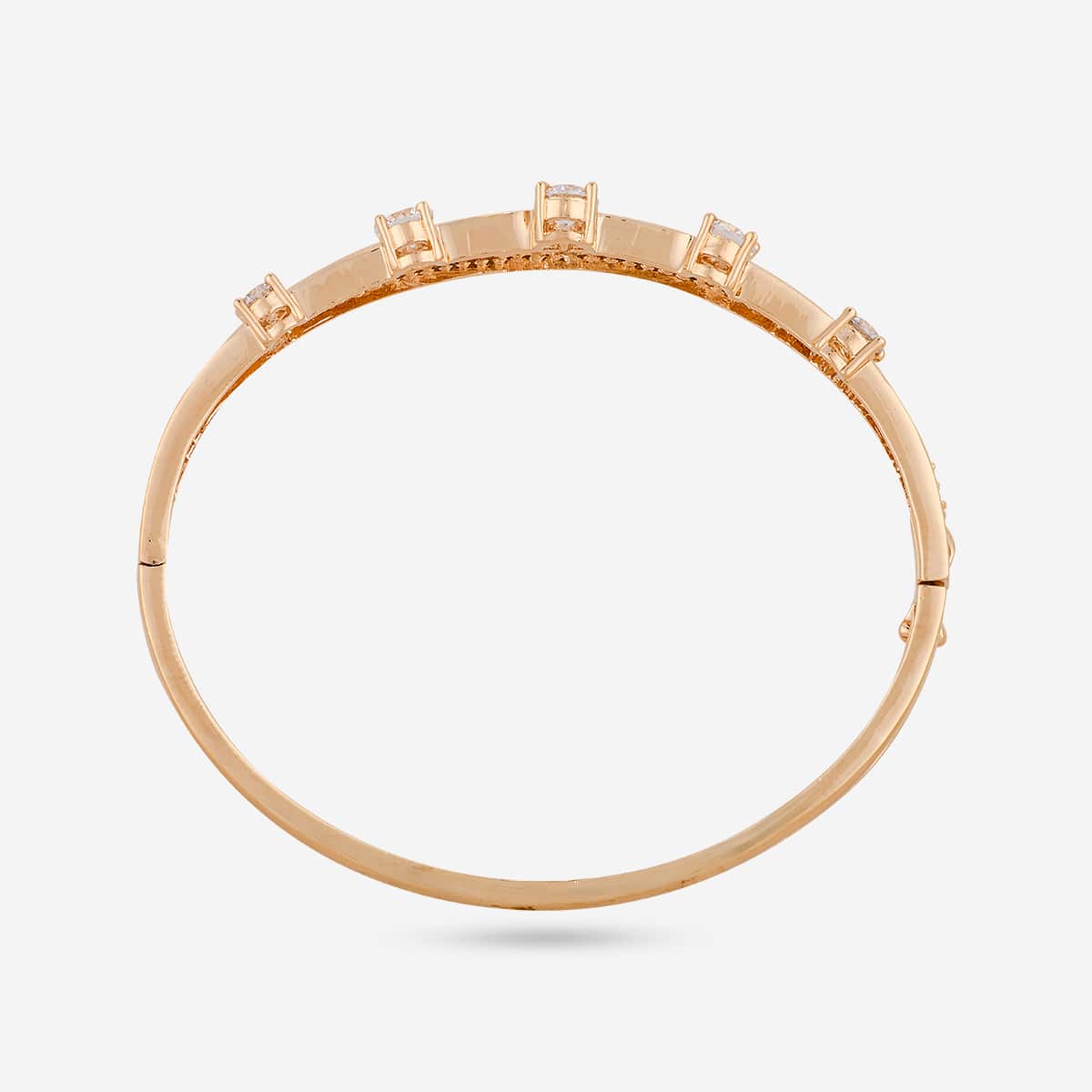 Gold-tone zircon kada with white stones, top view showing stone arrangement.
