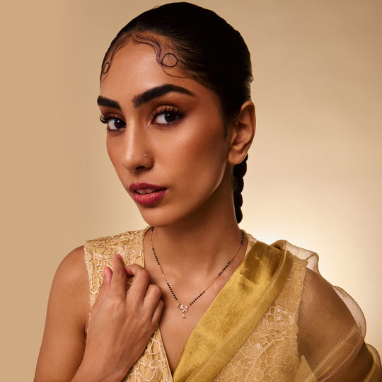 Model wearing zircon mangalsutra with drop pendant, elegant look.
