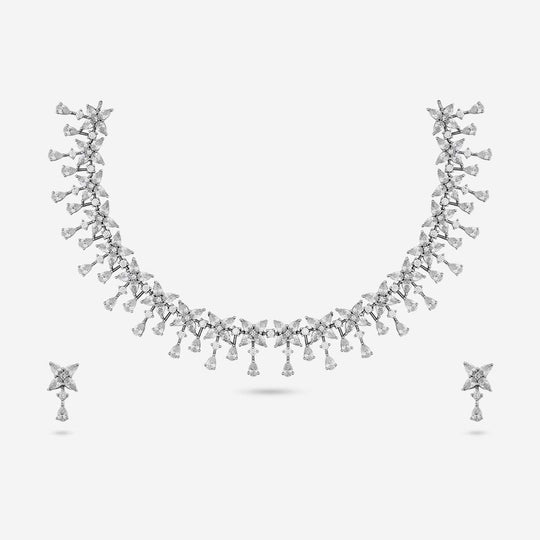 Zircon necklace and earrings set with star and pear shapes on white background.