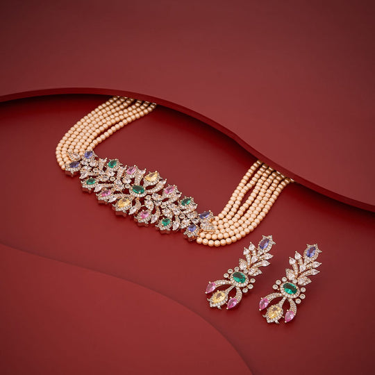 Zircon necklace set with multicolored stones and pearls on red background.