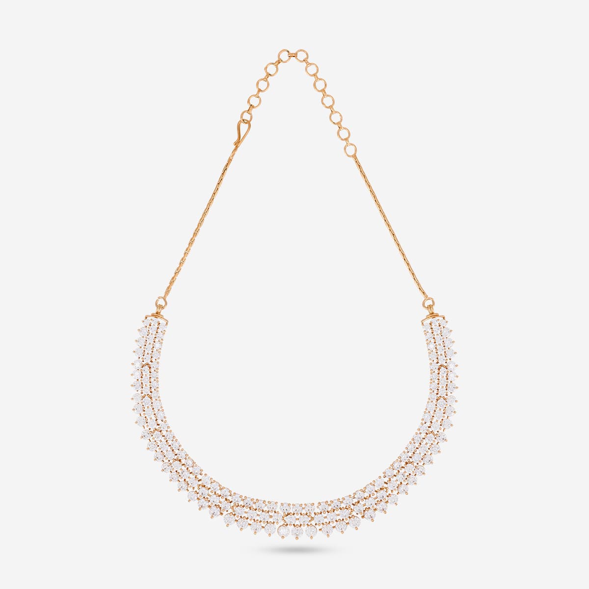 Close-up of gold-tone zircon necklace with chain on a white background.