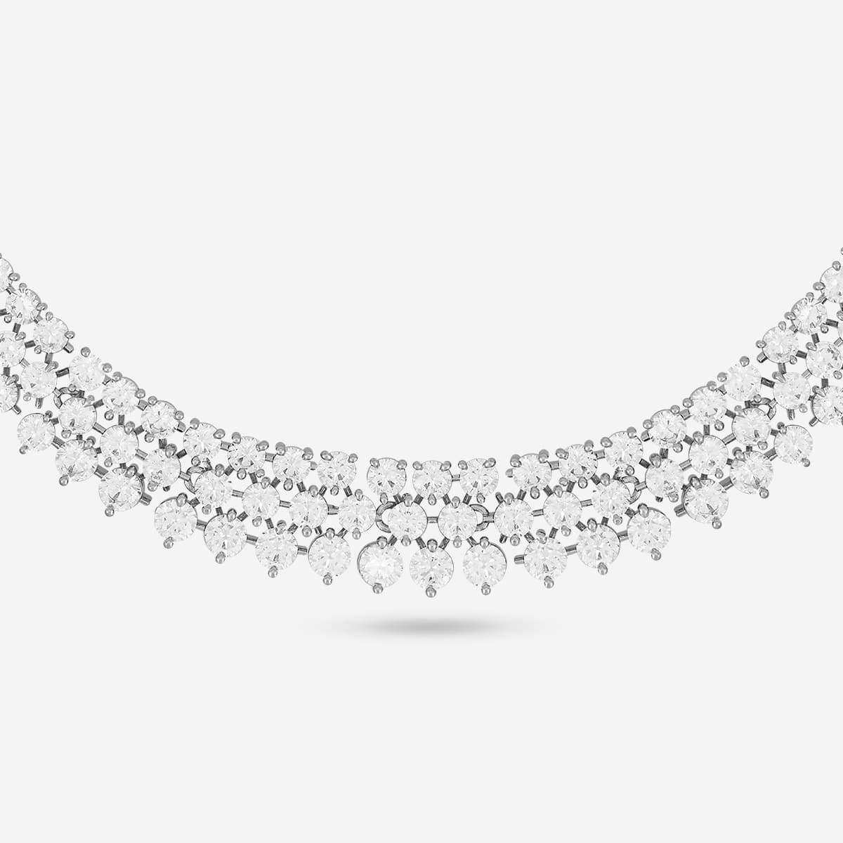Detailed view of zircon necklace with white stones.