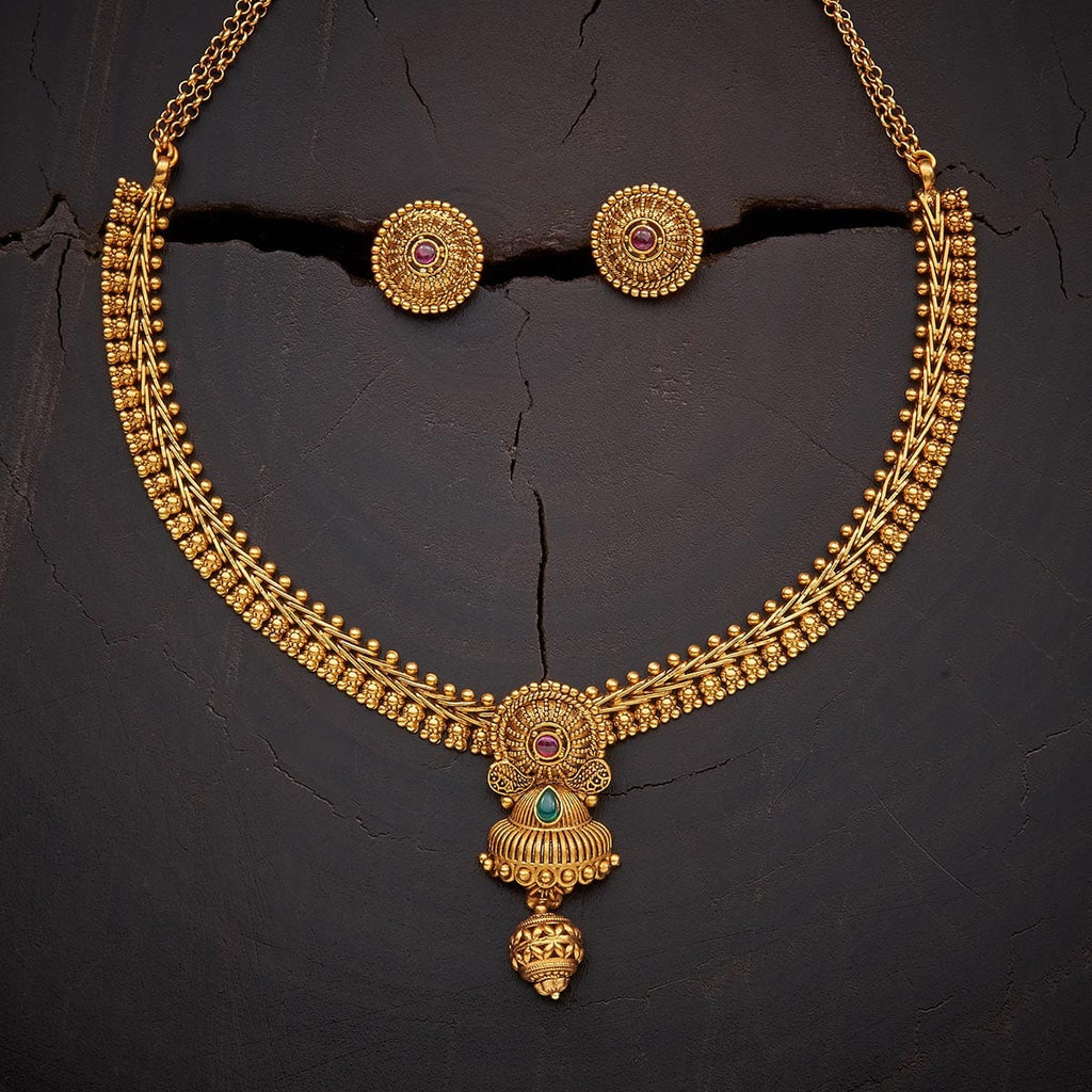 Antique gold ruby necklace with uncut diamond pendant